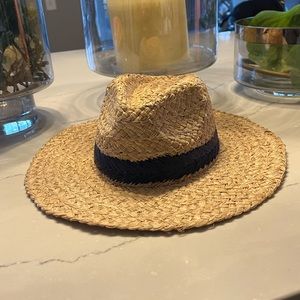 Straw hat with navy ribbon